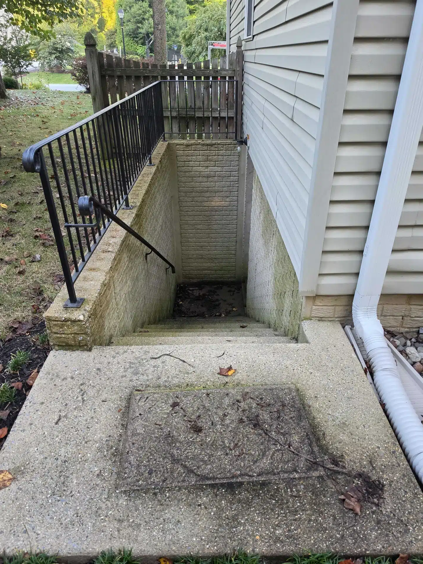 Basement stairwell before cleaning